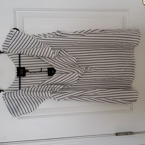 White and navy blue pinstriped blouse with ruffle. Size L